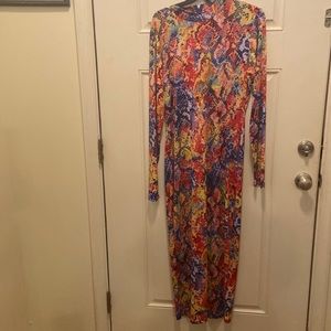 Never worn multi colored long sleeves long dress/ zippers in the back